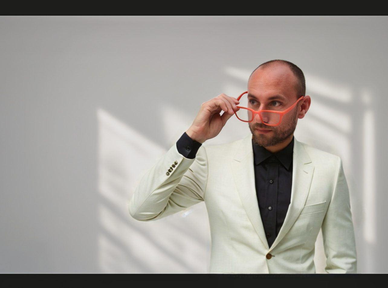 Matthew in orange glasses, photographed by RVXSTUDIO